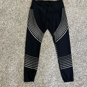 Black workout leggings with silver stripes